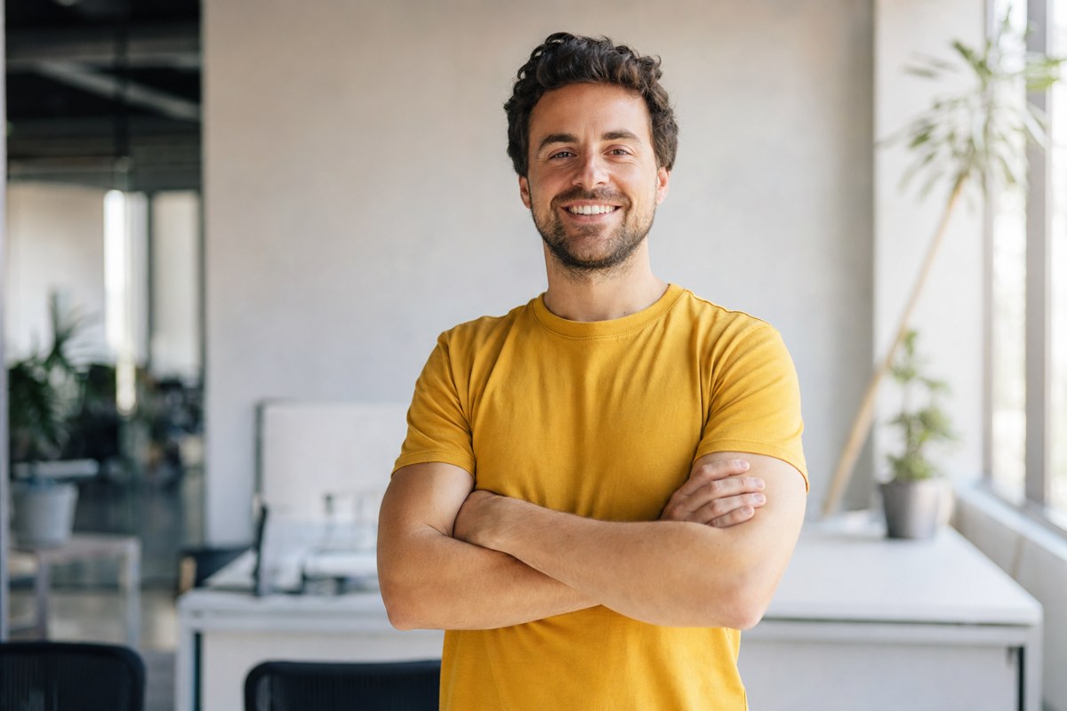 Confident marketer beside an upward growth chart